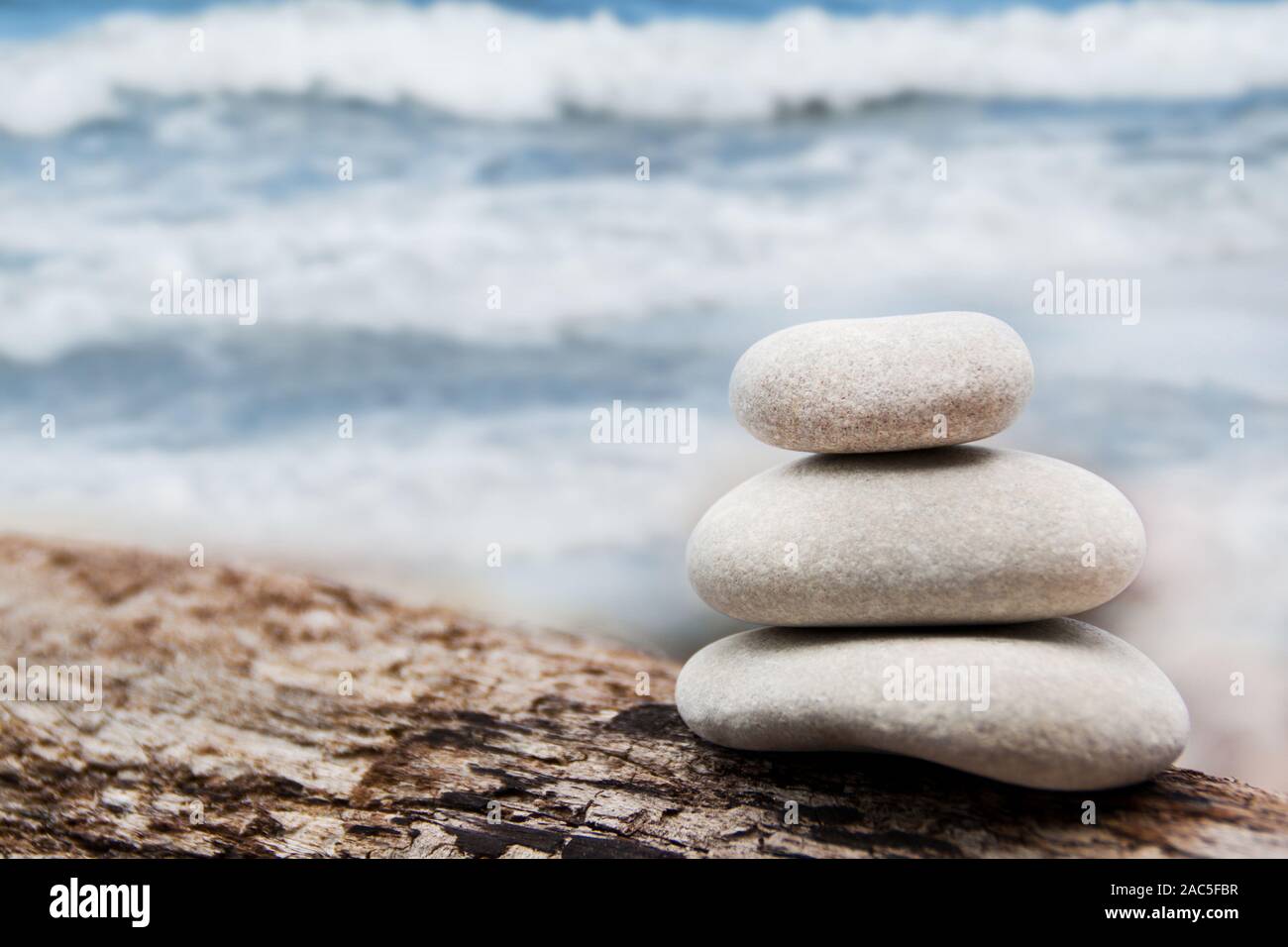 Wellness stones and sea background Stock Photo Alamy