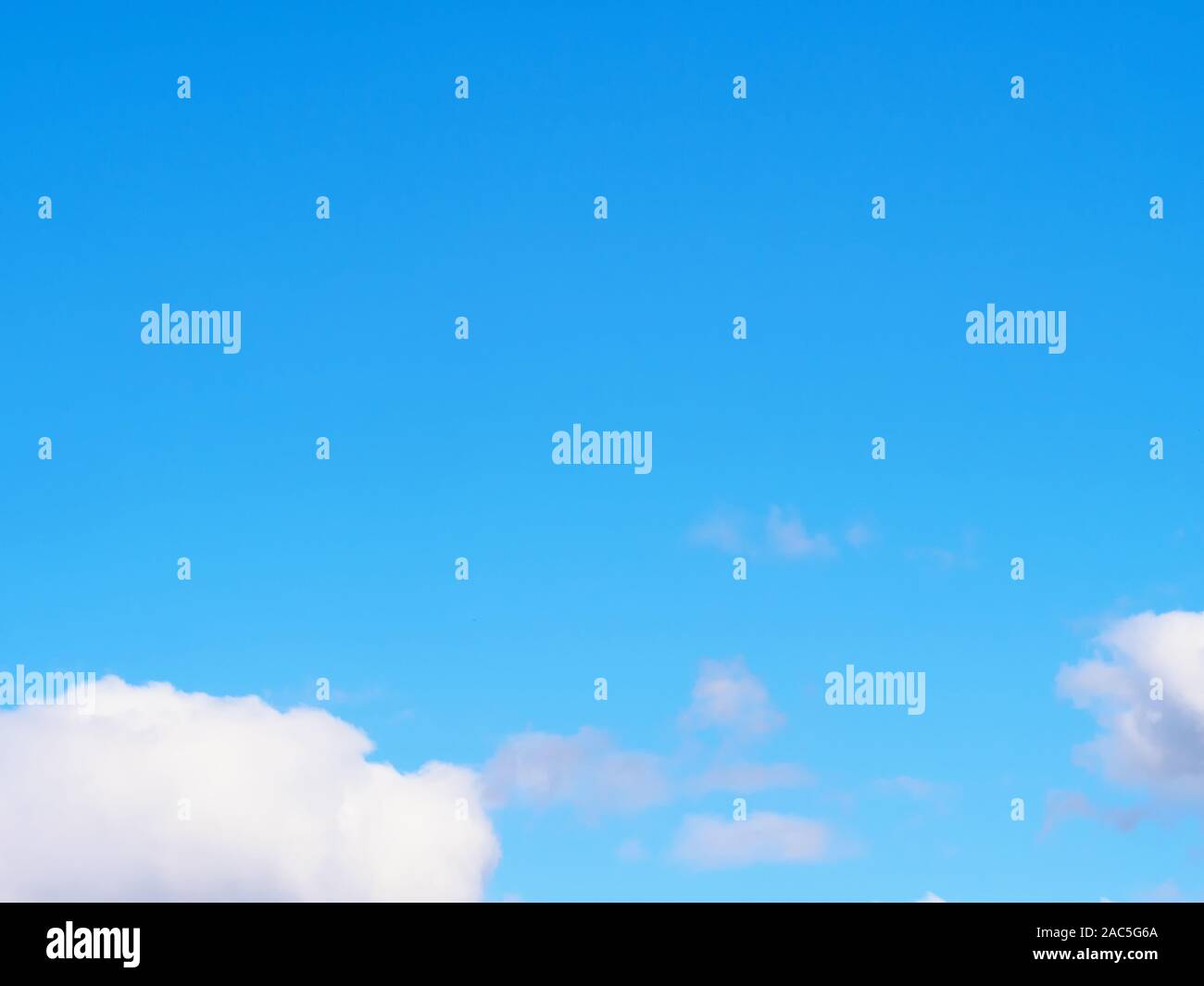 White clouds on a blue sky background Stock Photo - Alamy