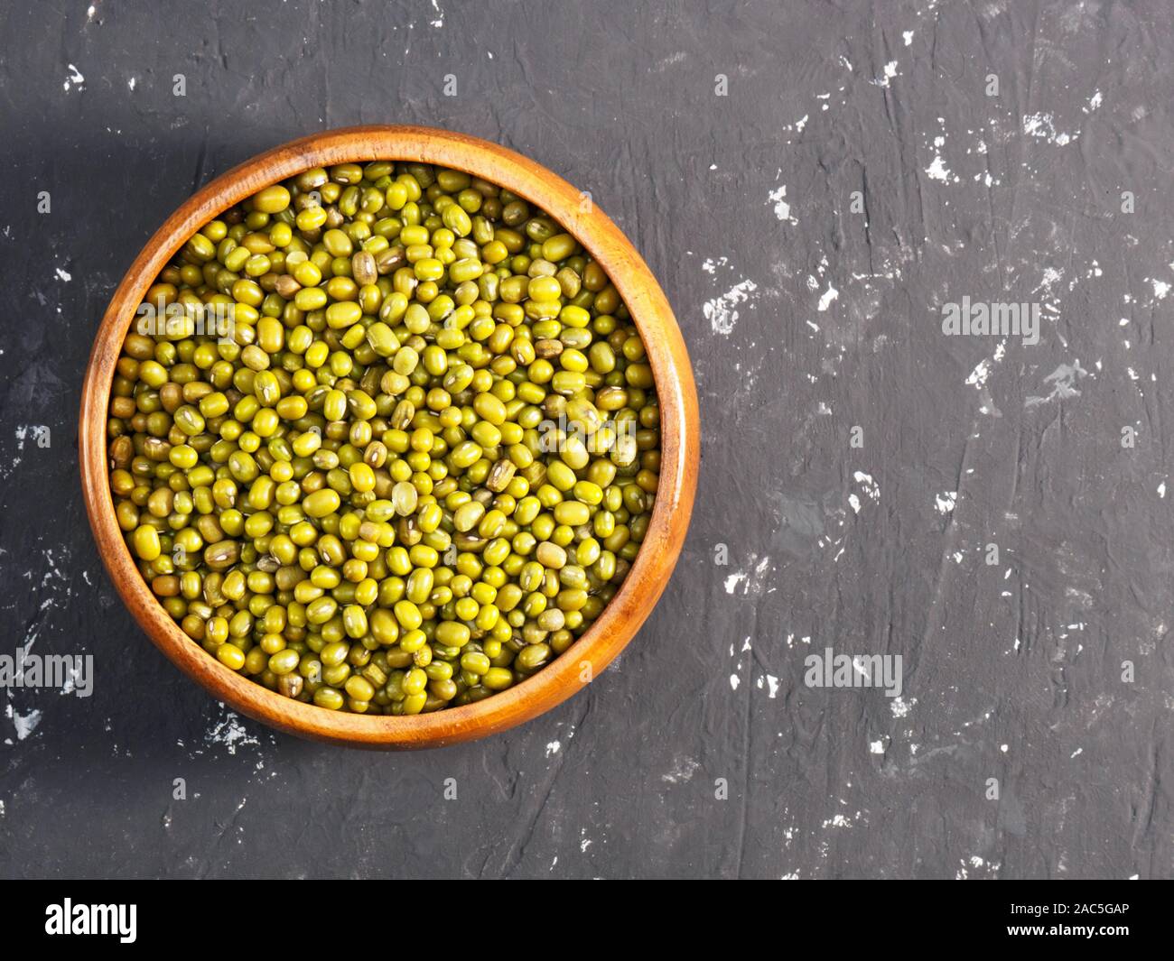 Green gram on a black concrete background. Indian cuisine ingredients Stock Photo