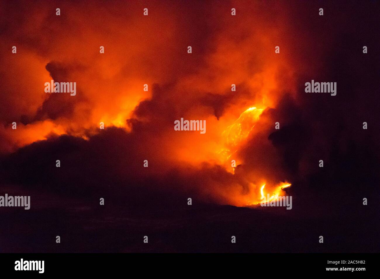 Lava from Kilauea volcano as it flows into the sea near Kalapana on the