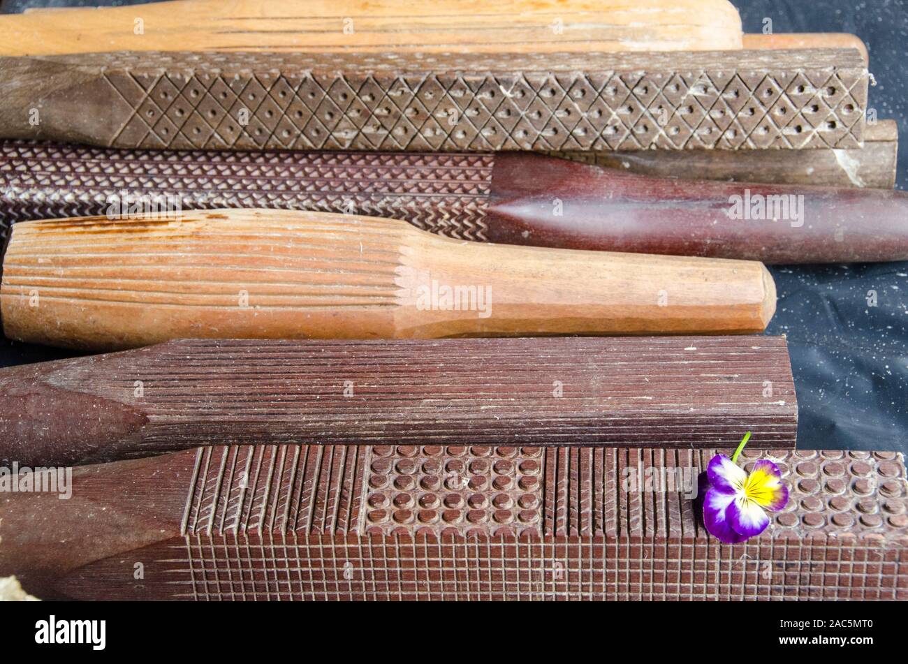 A close-up view of carved wooden beaters used to make kapa (or tapa)  cloth, Big Island. Stock Photo