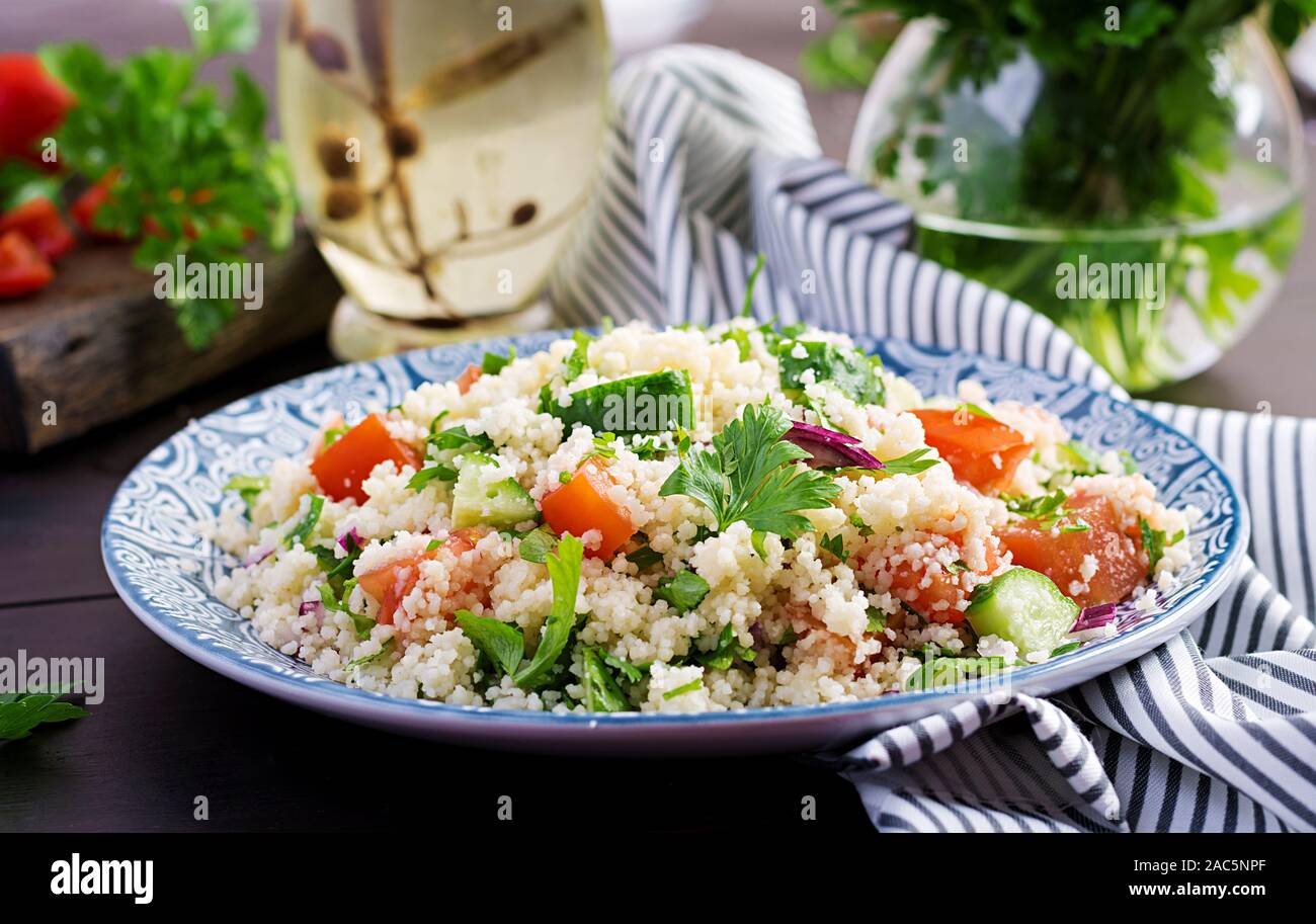 Traditional Lebanese Salad Tabbouleh. Couscous with parsley, tomato
