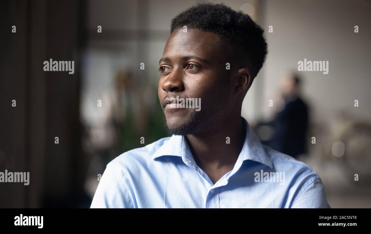 Head shot close up young thoughtful african american businessman. Stock Photo