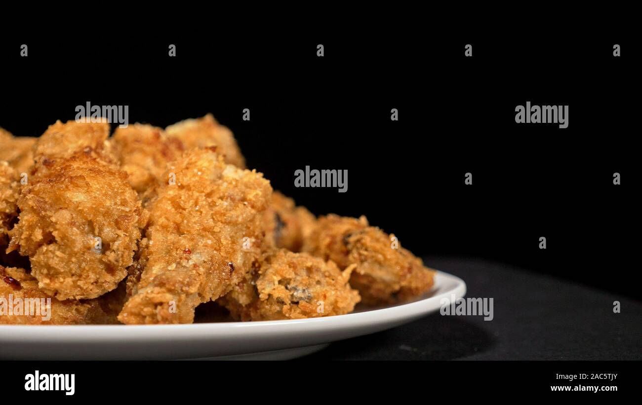 Cool beautiful fresh juicy cooked chicken wings in breading. Buffalo