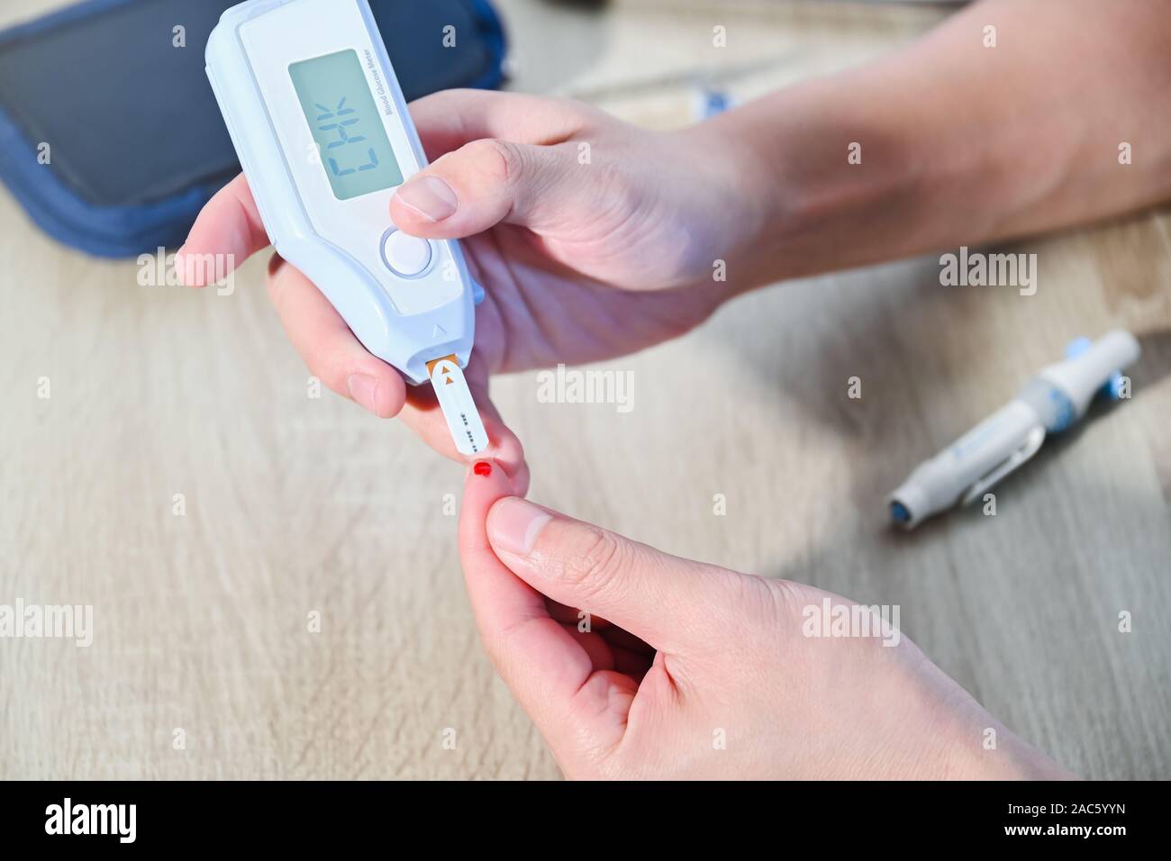 Diabetes patients use a sugar glucose meter to measure their blood
