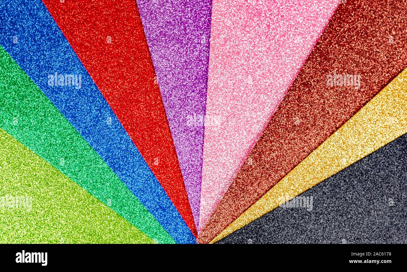 Rainbow sparkles background . Celebration decoration backdrop. Top view, copyspace . Stock Photo