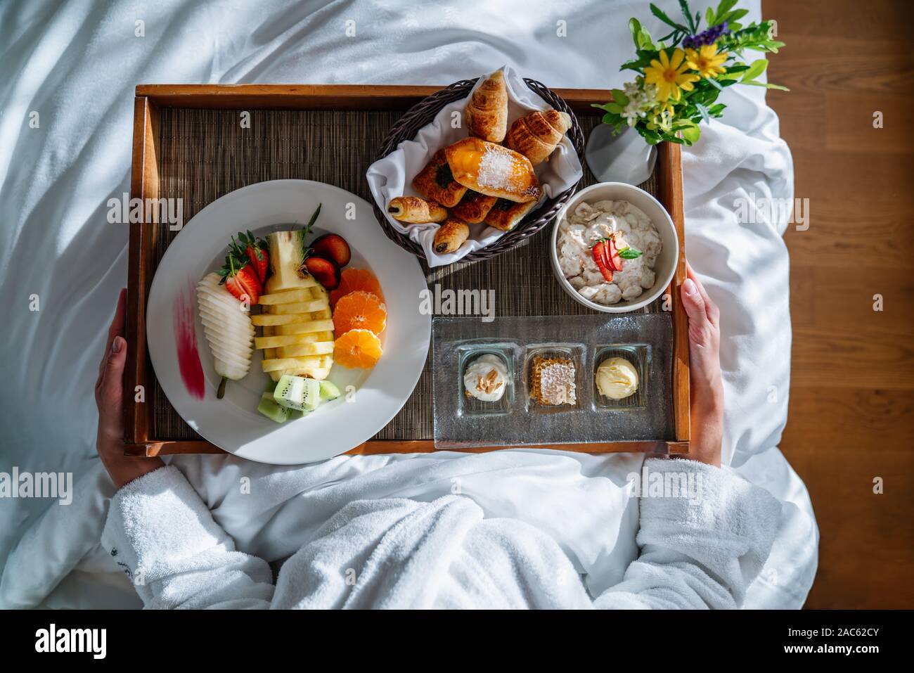 scrumptious breakfast with plenty of variety in bed on a nice weekend. Stock Photo