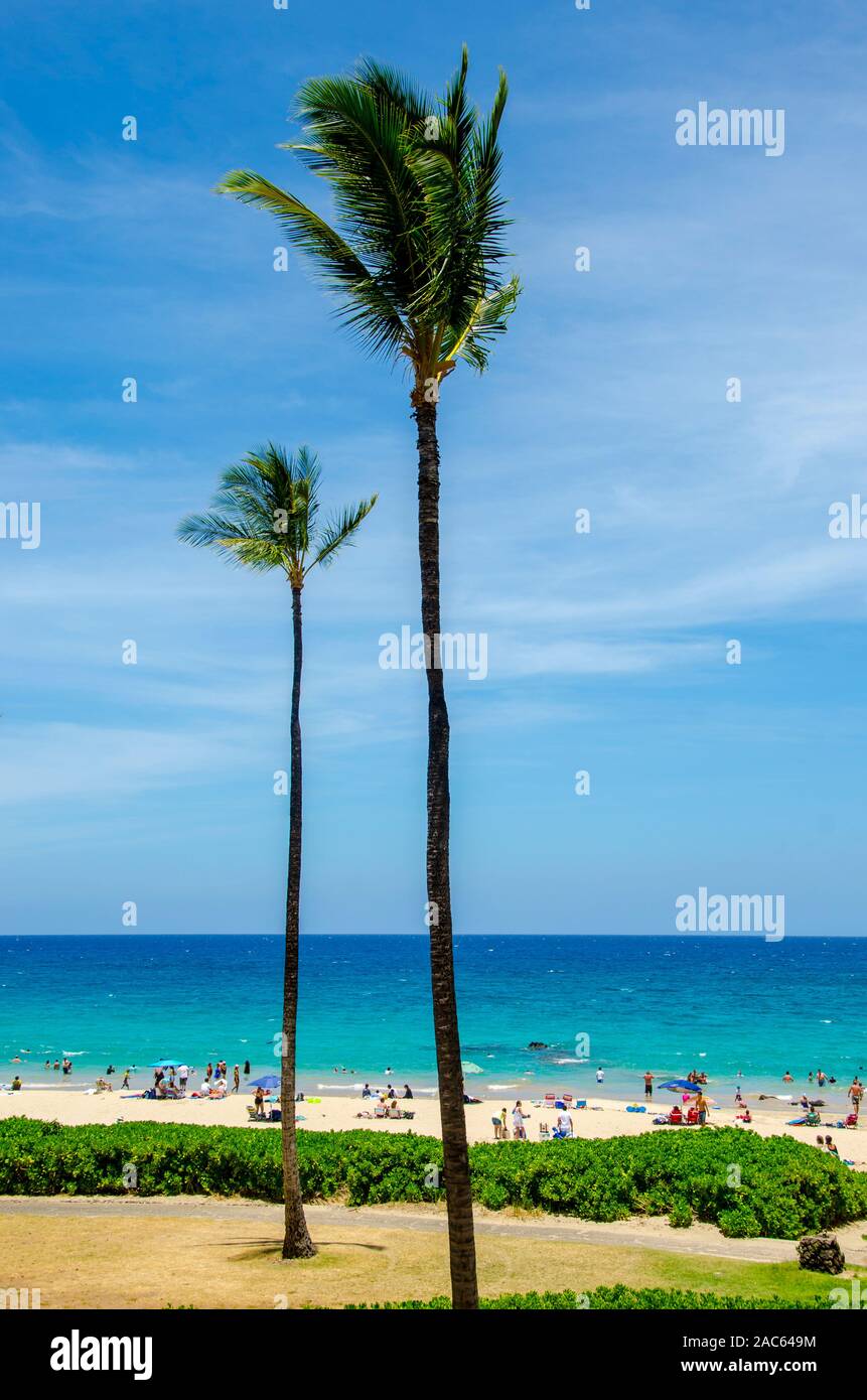 People enjoying a sunny day at Hapuna Beach, along the Big Island's Kohala Coast. This white sand beach has been rated one of the best beaches in the Stock Photo