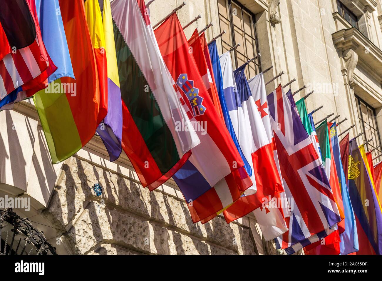 Hofburg former Imperial Palace. Currently residence of the Austrian President,  International display of flags, Vienna, Austria Stock Photo