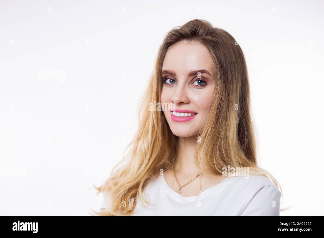 Closeup portrait of beautiful happy young woman with blonde hair and ...