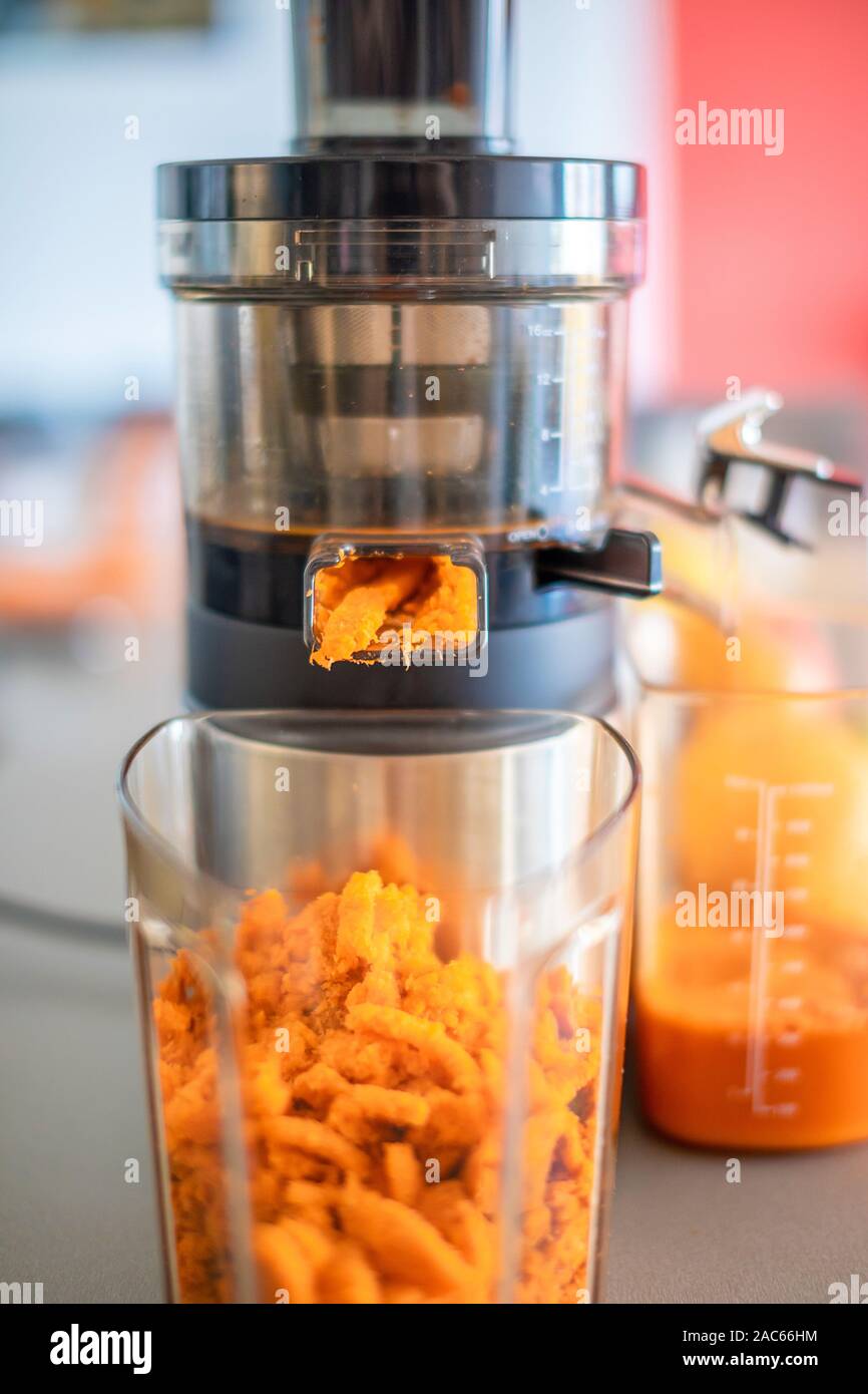 Close up of carrot pulp from process preparation of fresh juice in