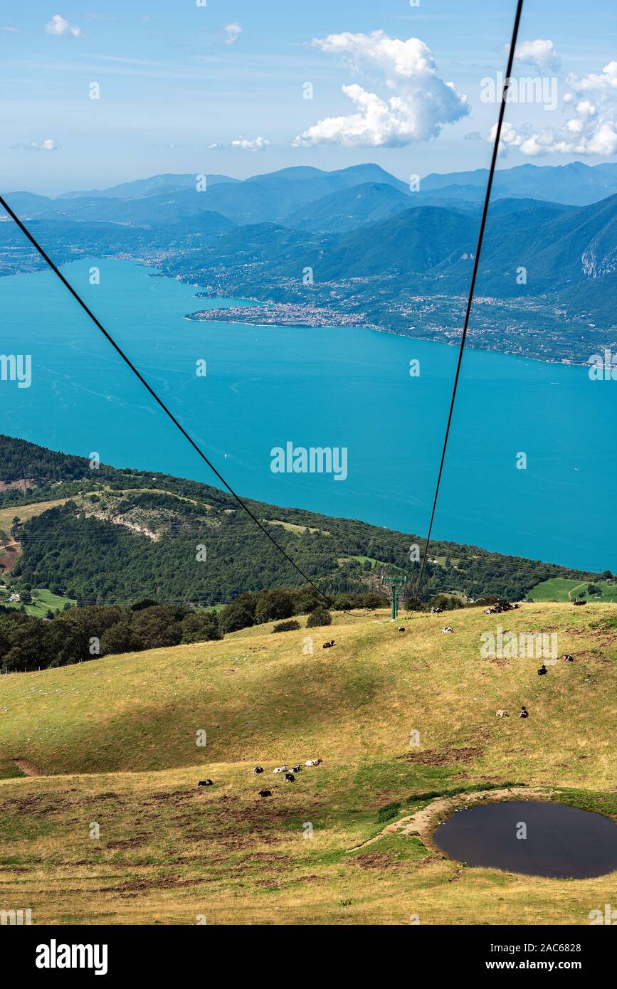 Aerial view of the Lake Garda with green pastures in Italian Alps, photographed from Monte Baldo. Veneto and Lombardy region, Italy, south Europe Stock Photo