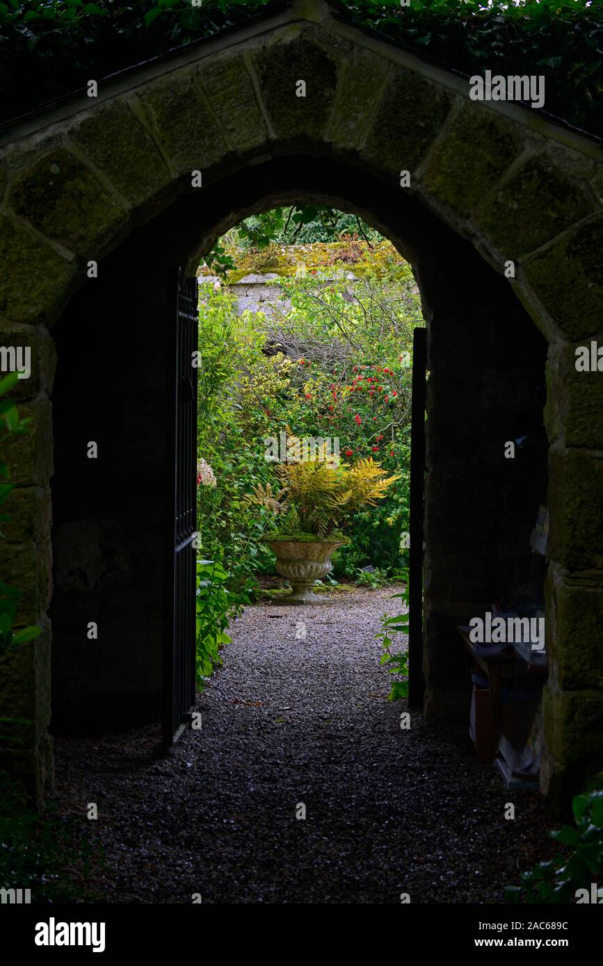 garden entrance,archway,stone arch,dark,open up, open up,courtyard,gardens,gardening,secret garden,RM Floral Stock Photo