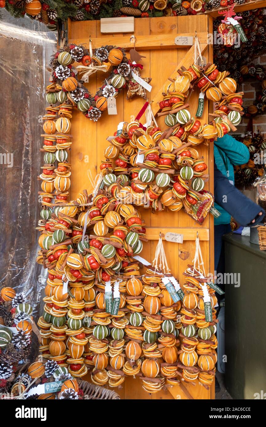 Christmas Market in Winchester, Hampshire, UK - maket stall with dried fruit garlands Stock Photo