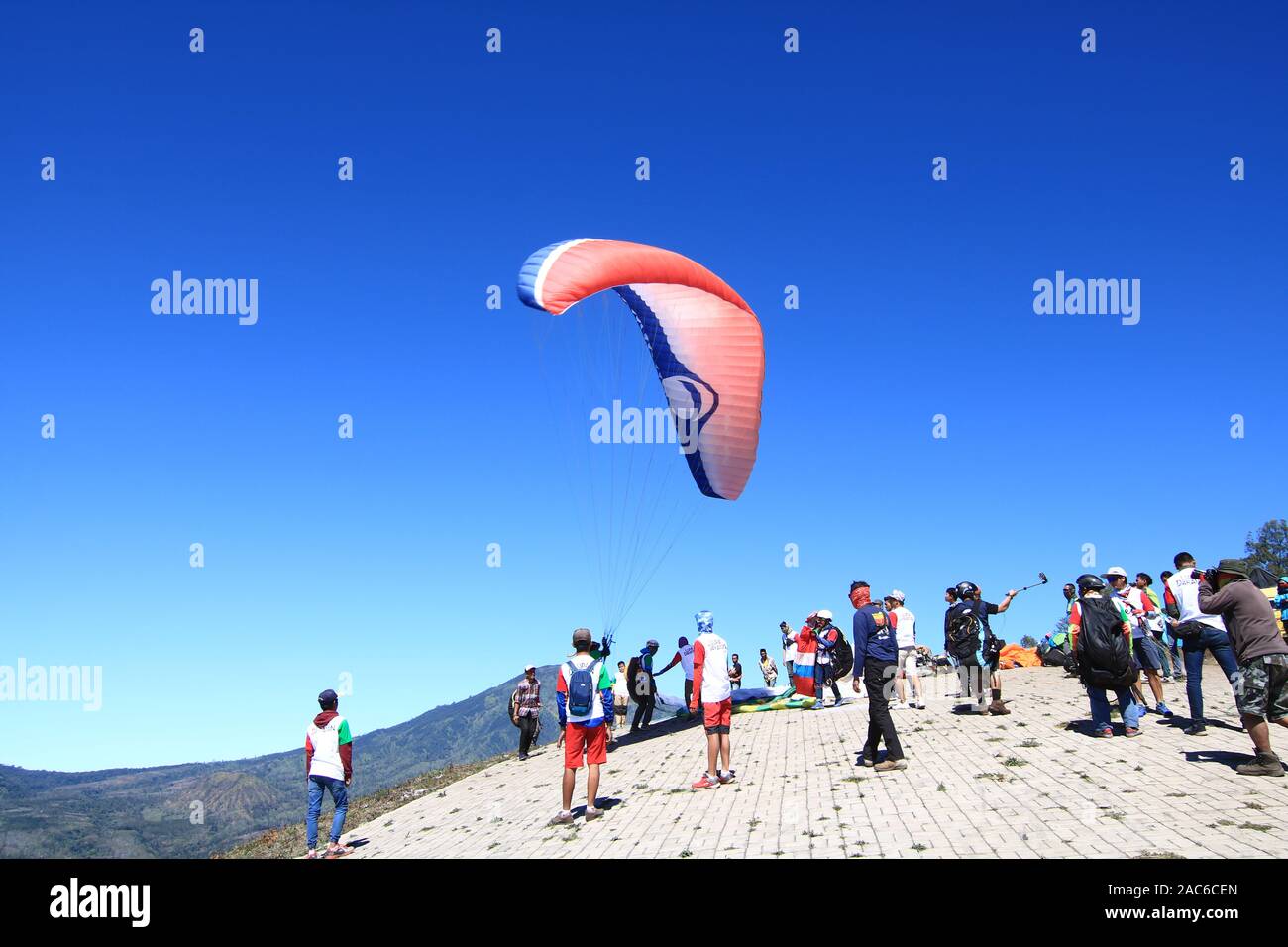Besides activities paragliding, Puncak Megasari is often visited by  mountain bike and trail moto sports Stock Photo - Alamy