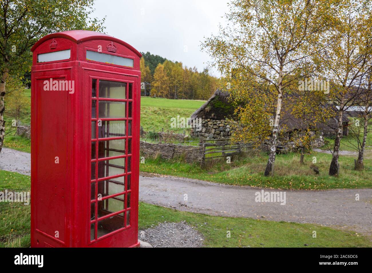 Beautiful phone booth in the village in Scotland, cloudy weather ...