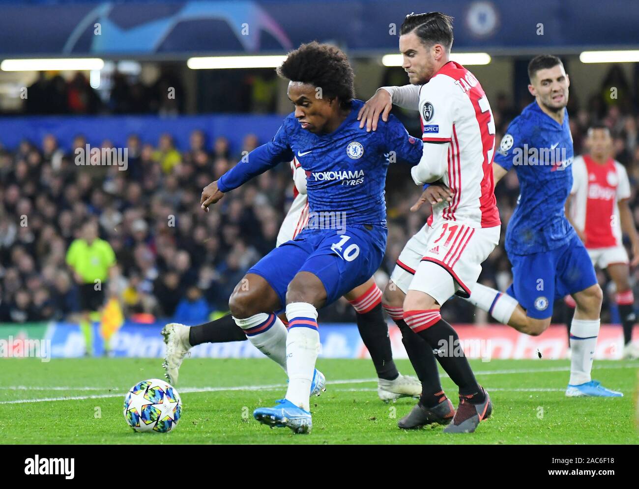 LONDON, ENGLAND - NOVEMBER 5, 2019: Willian Borges da Silva of Chelsea and Nicolas Tagliafico of Ajax pictured during the 2019/20 UEFA Champions League Group H game between Chelsea FC (England) and AFC Ajax (Netherlands) at Stamford Bridge. Stock Photo