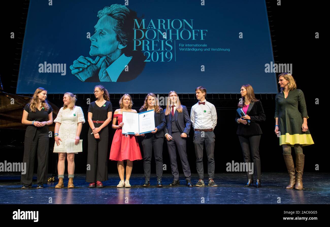 Hamburg, Germany. 01st Dec, 2019. Members of the climate protection movement Fridays for Future, Julia-Niharika Sen (2nd from right), moderator, and Maja Göpel (r), General Secretary of the German Advisory Council on Global Change, are on stage in Hamburg during the award ceremony of the Marion Dönhoff Prize. This year, the main prize for international understanding and reconciliation goes to EU Council President Tusk and the promotional prize to the climate protection movement Fridays for Future. Credit: Daniel Bockwoldt/dpa/Alamy Live News Stock Photo