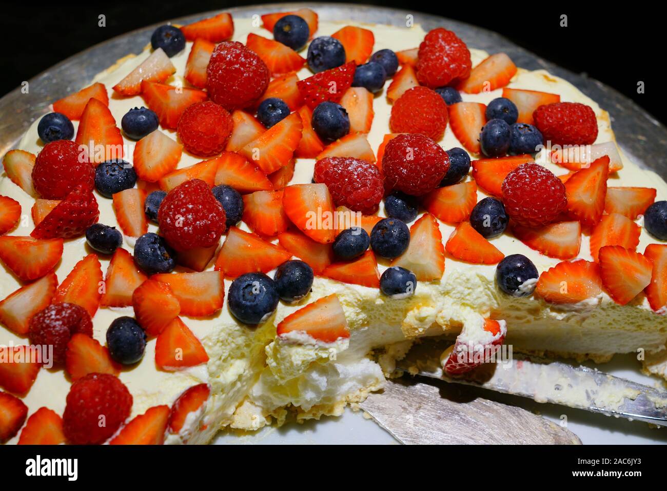 Traditional Australian pavlova meringue cake with fresh berries Stock