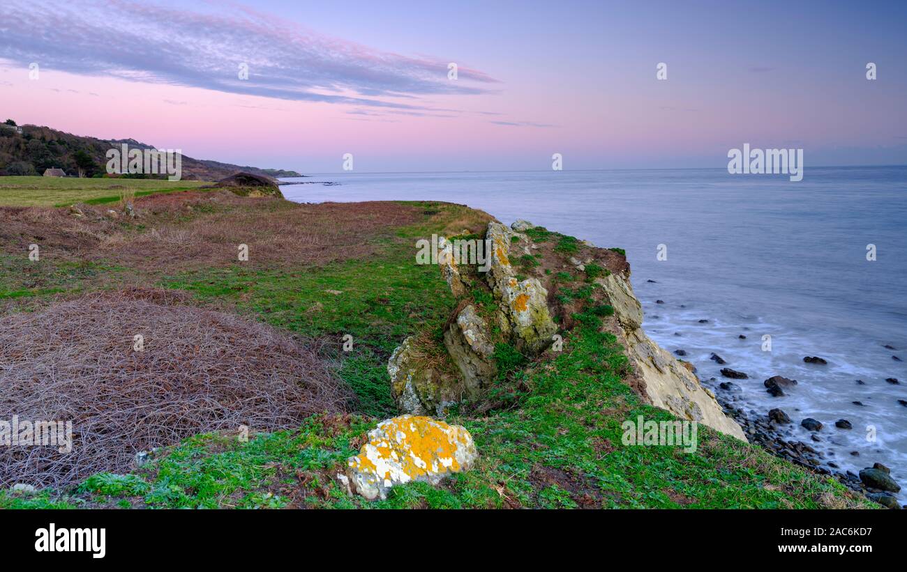 Niton, UK - November 29, 2019:  Sunset over St Catherine's Point Light House from near Reeth Bay on the Isle of Wight, UK Stock Photo