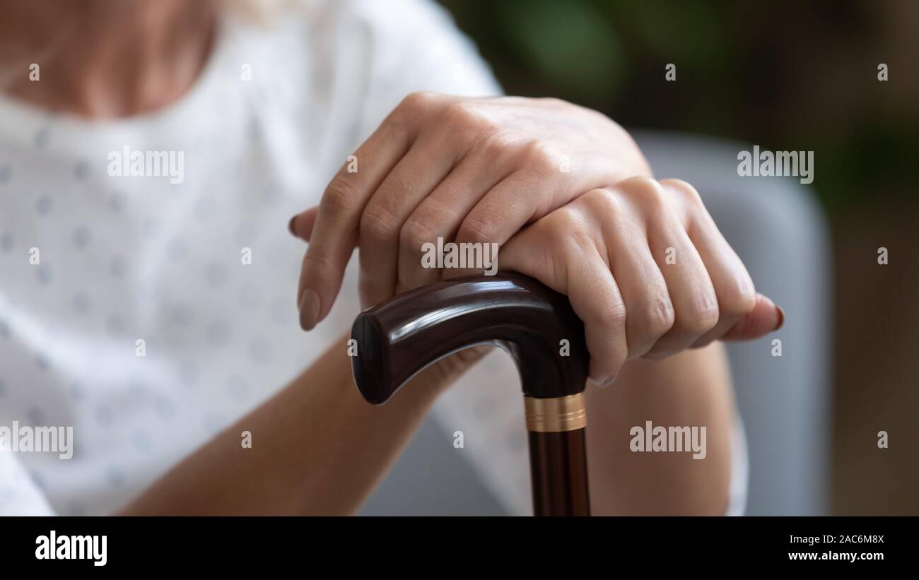 Close up concept image old woman holding walking stick Stock Photo Alamy