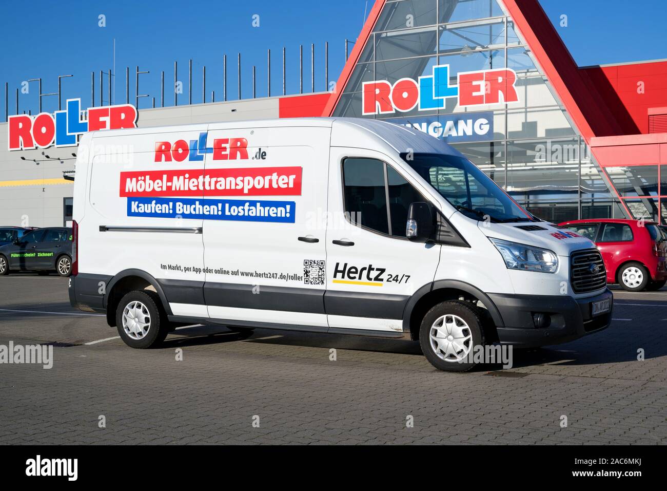 Hertz 24/7 Roller rental van at store. Roller is a German furniture discounter based in Gelsenkirchen. Stock Photo