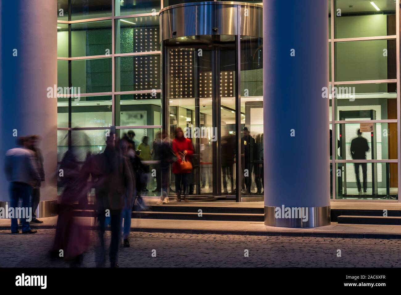 The movement of people at the entrance to modern building Stock Photo