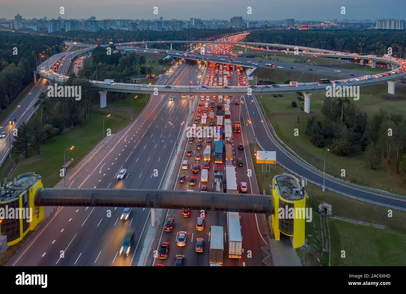 View from the air on the movement of cars on the overpasses at the intersection with the ring road and the exit from the city Stock Photo