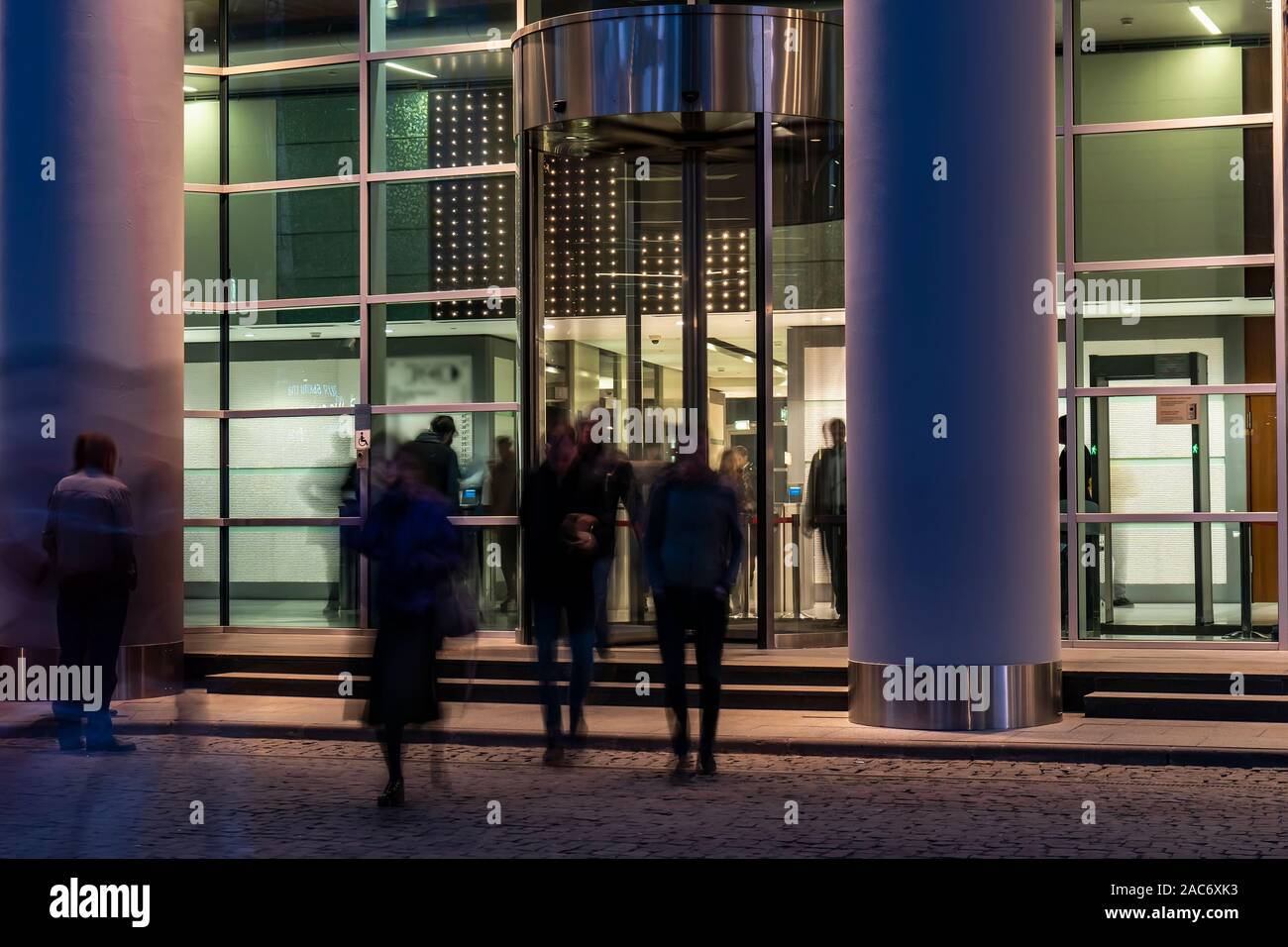 The movement of people at the entrance to modern building Stock Photo