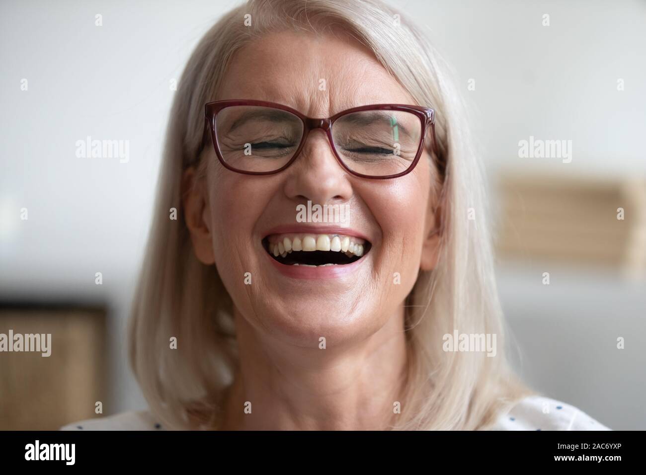 Close up portrait middle-aged attractive laughing woman Stock Photo