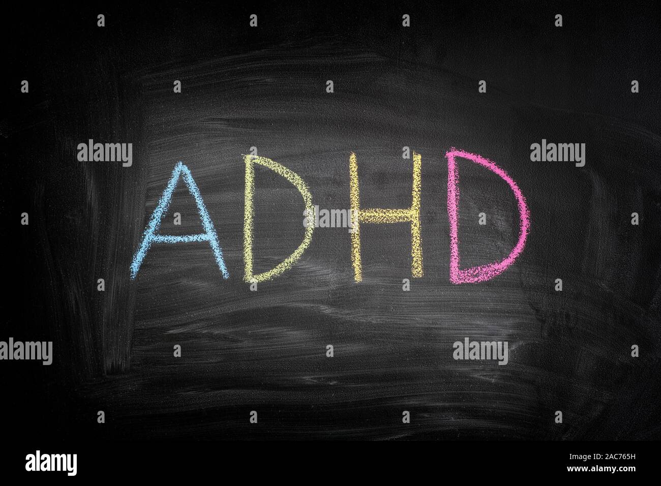 ADHD. Abbreviation ADHD on a blackboard. ADHD is Attention deficit hyperactivity disorder. Stock Photo