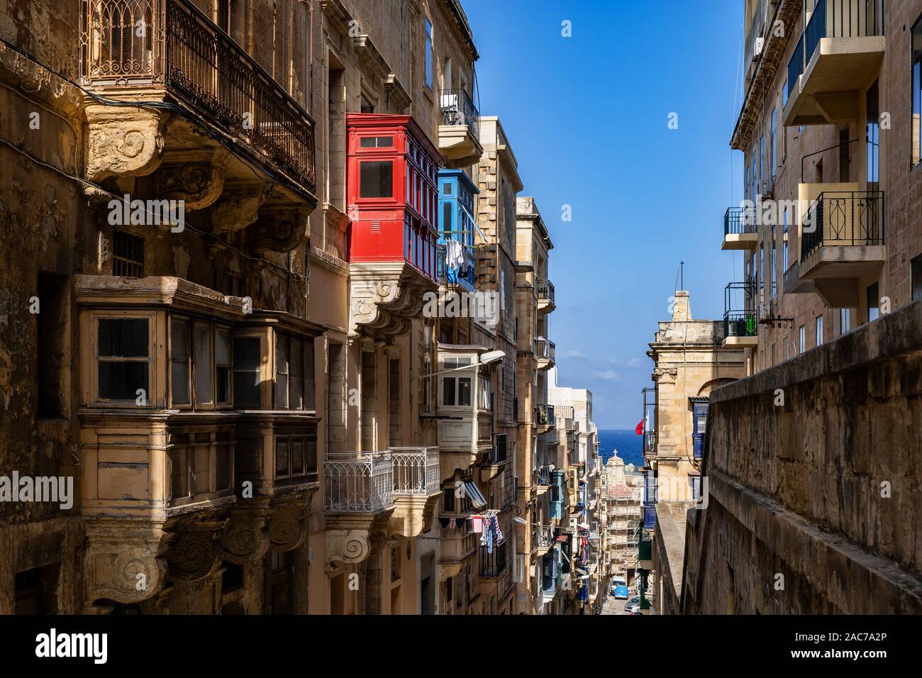 City of Valletta in Malta, traditional houses with open and closed balconies Stock Photo