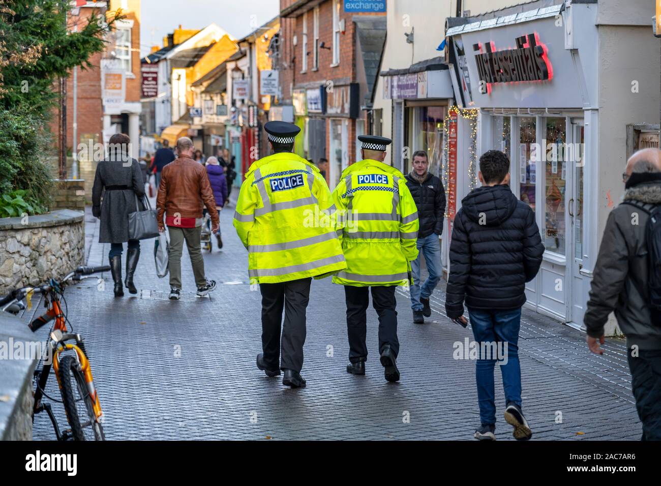 two police men walking the streets of colchester stock photo alamy