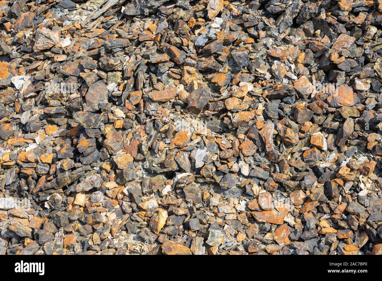 Pile of broken rock at a disused copper mine Stock Photo