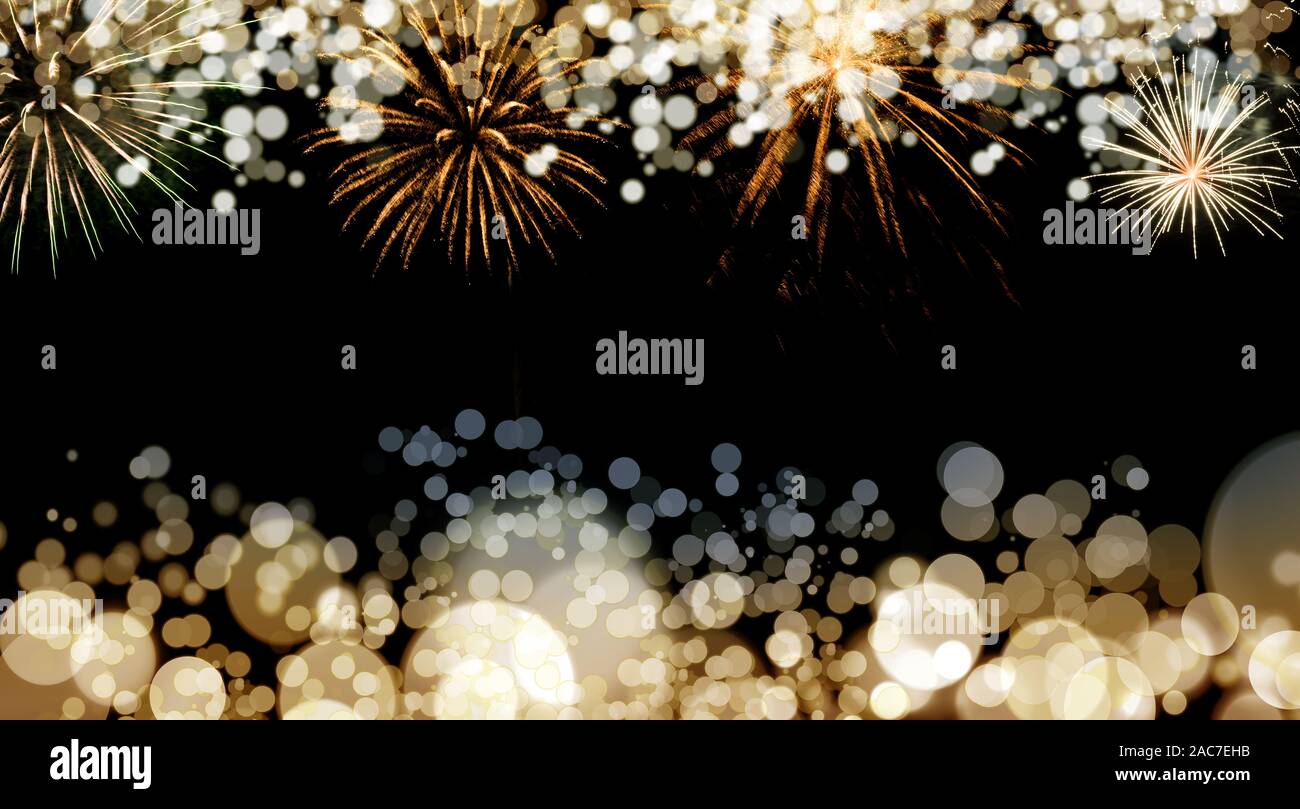 New Year fireworks and blurred bokeh lights background Stock Photo