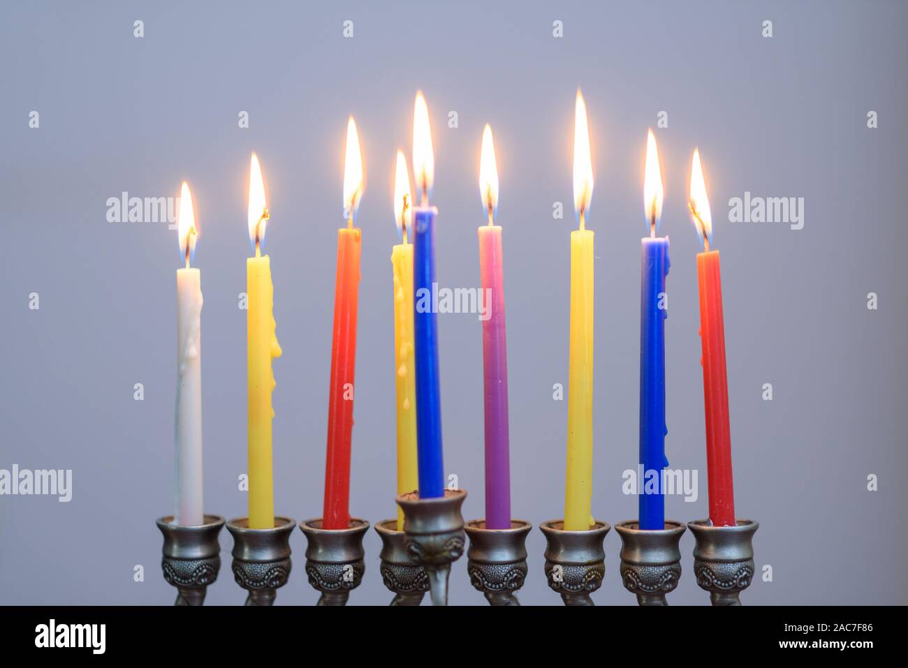 Jewish holiday Hanukkah background with menorah and colorful lighting