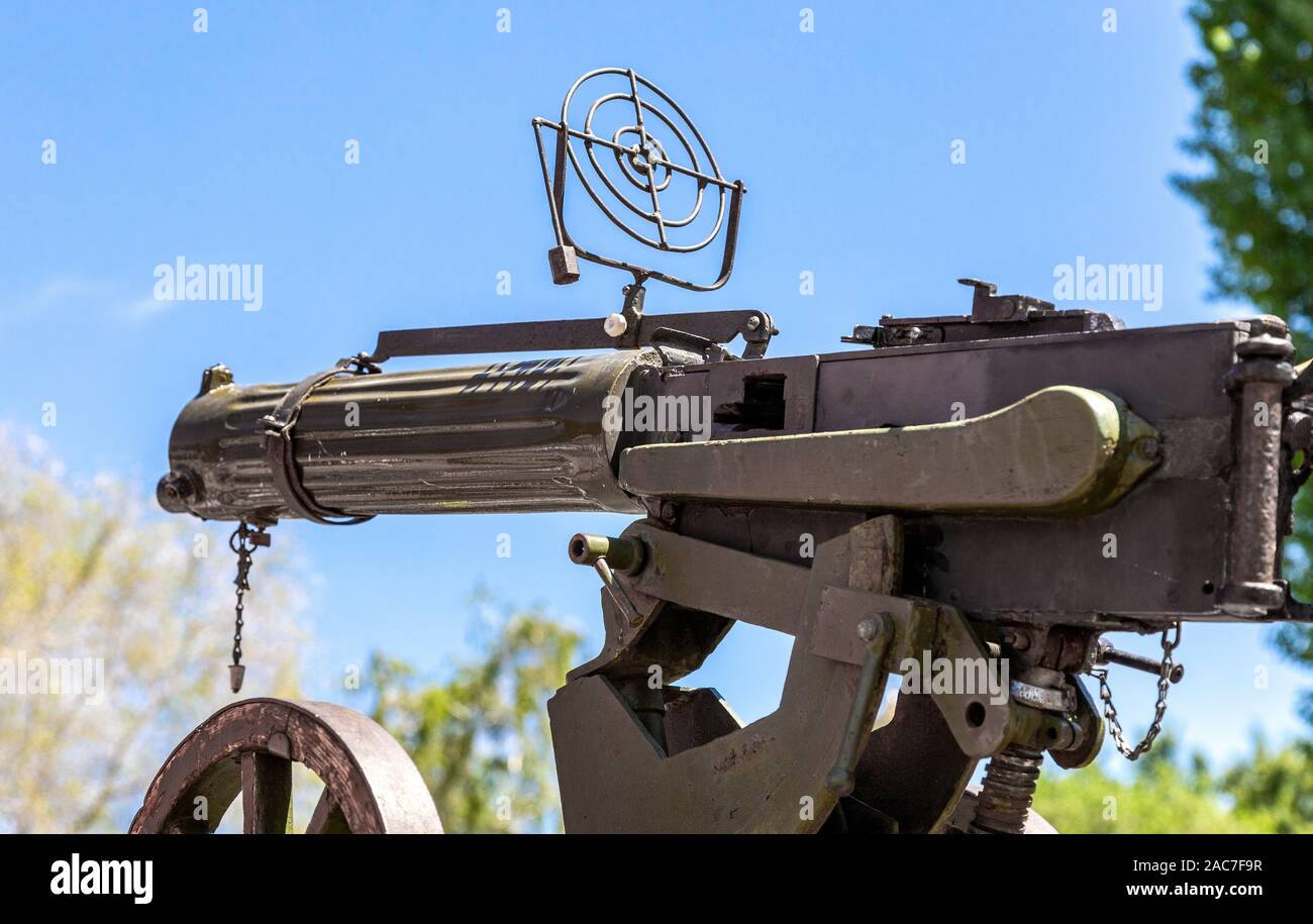 Old anti-aircraft machine gun in the background of the blue sky Stock Photo