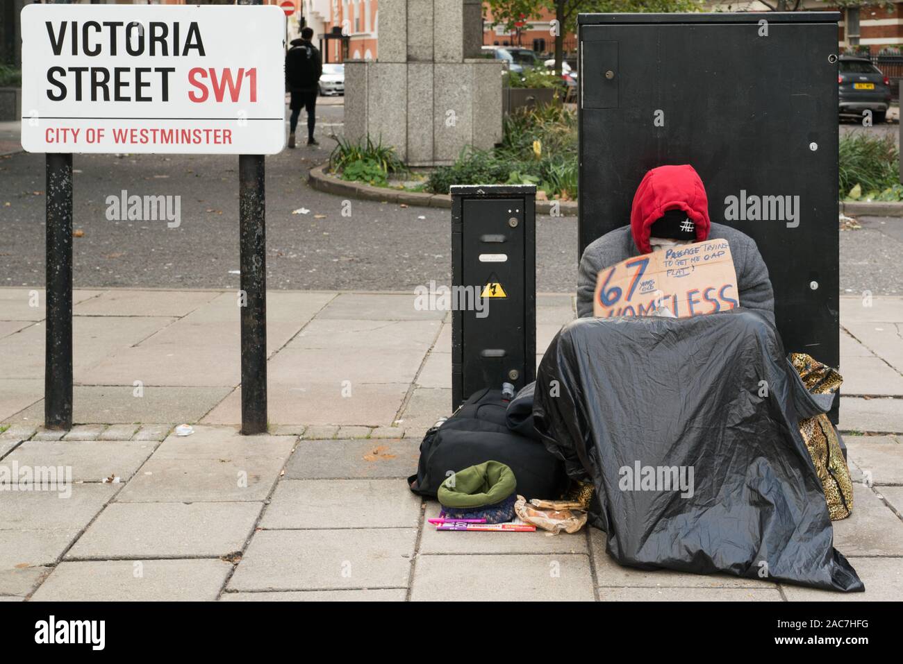 Homeless person in freezing cold street Stock Photo