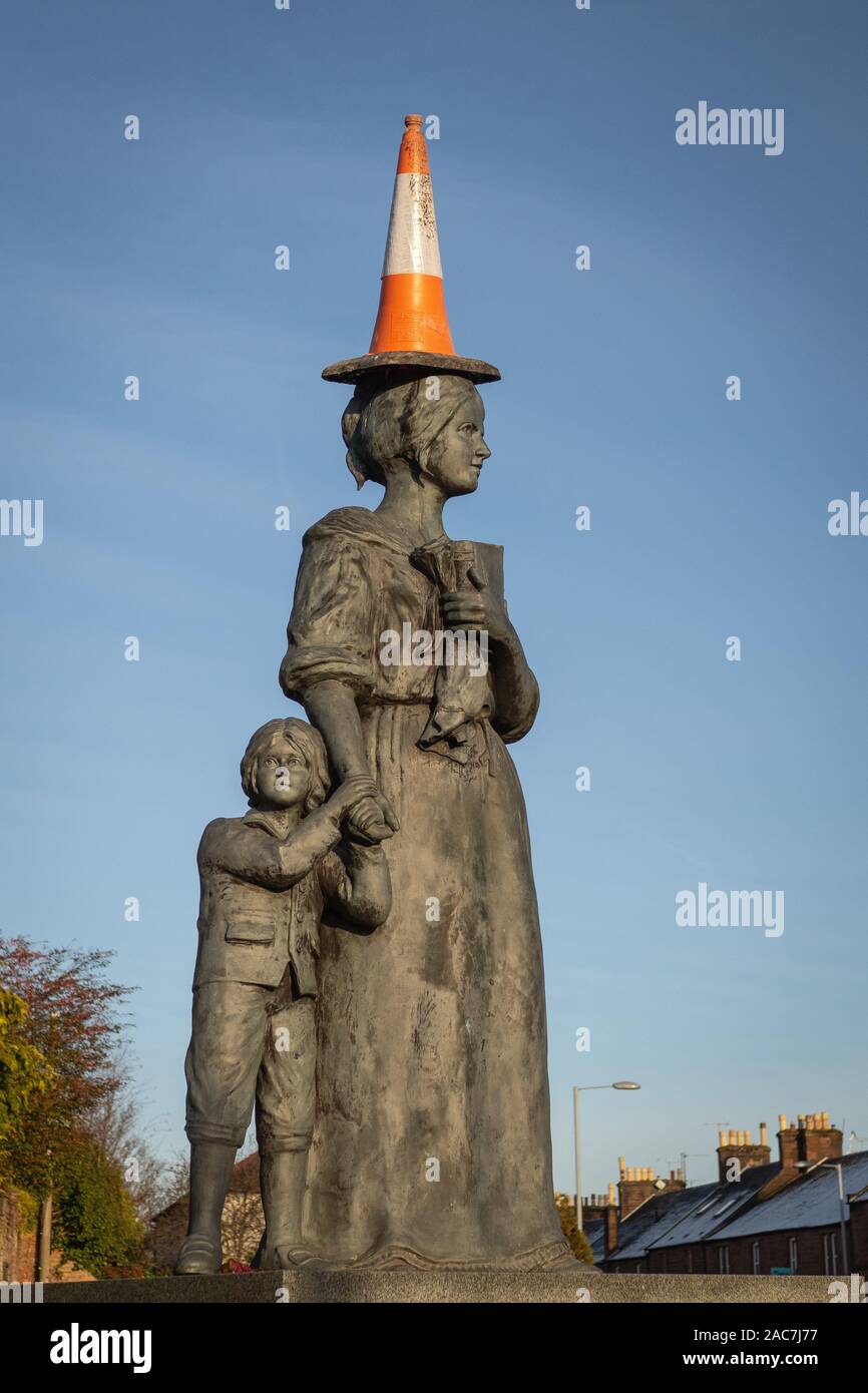 Statue of Jean Armour in Dumfries, Scotland, with a traffic cone on her