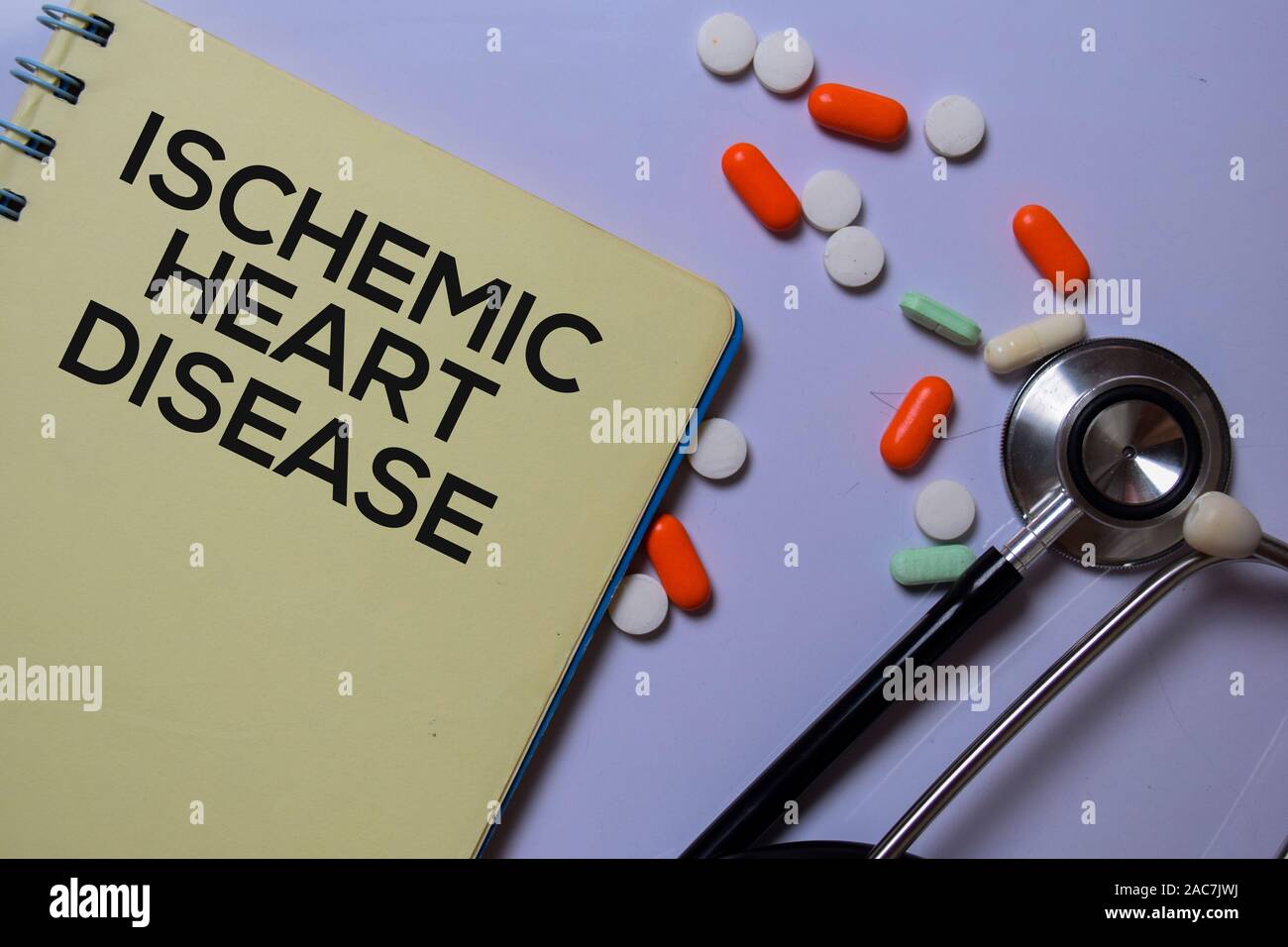 Ischemic Heart Disease write on a book isolated on white board background. Medical Concept Stock Photo