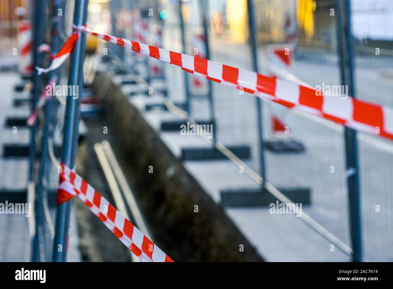 Red And White Striped Warning Tapes Restrict Access To The 