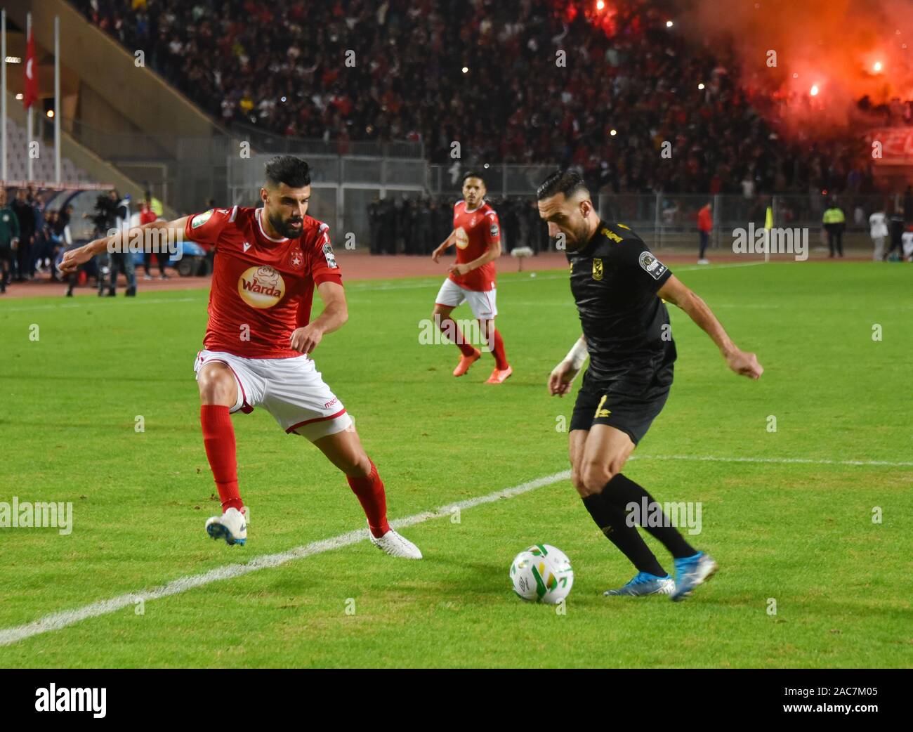 Al Ahly's Ali maaloul and Etoile's Zied boughatas in action during the CAF Champions League 2019 - 20 football match between Al-Ahly and Etoile sportive du sahel in Rades.(Final score: Etoile du Sahel 1 – 0 Al Ahly) Stock Photo