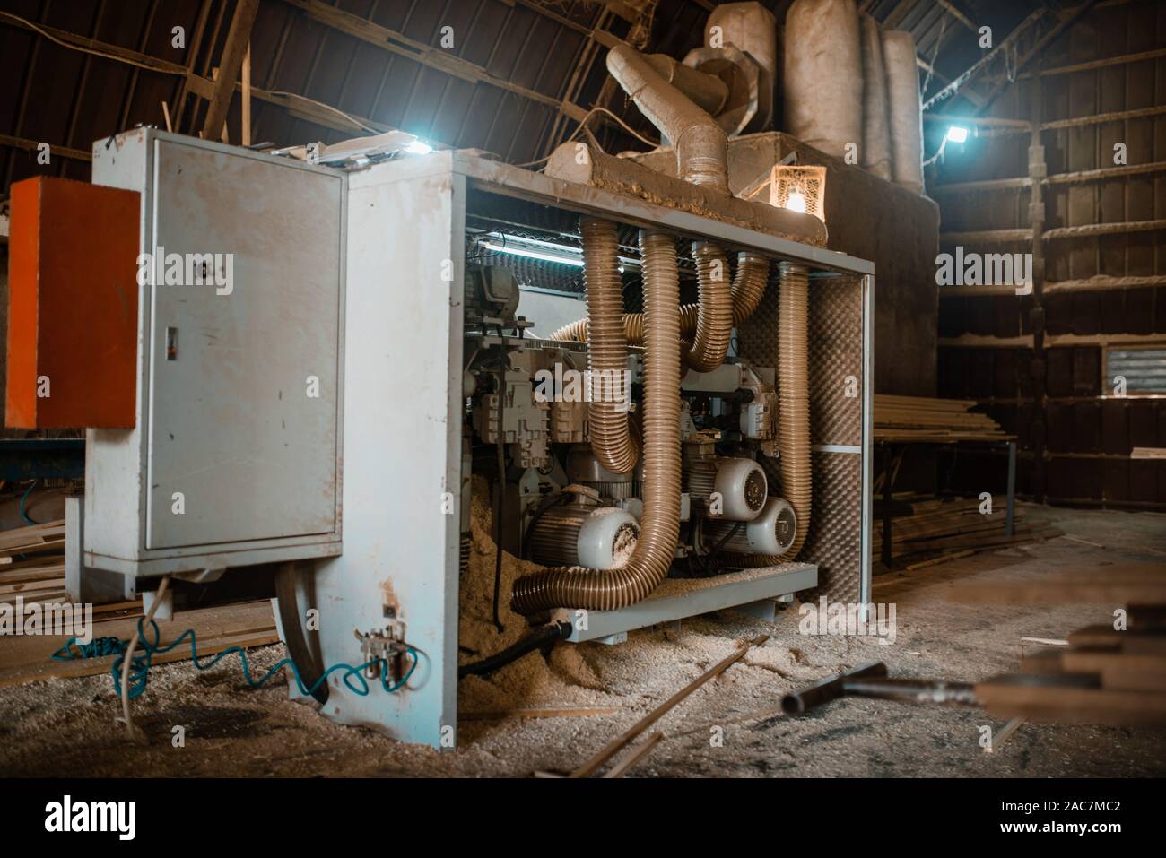 Woodworking machine in sawdust, nobody, sawmill Stock Photo