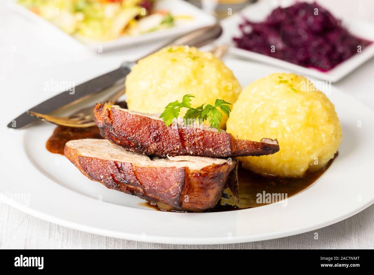 bavarian roasted pork with dumplings Stock Photo Alamy