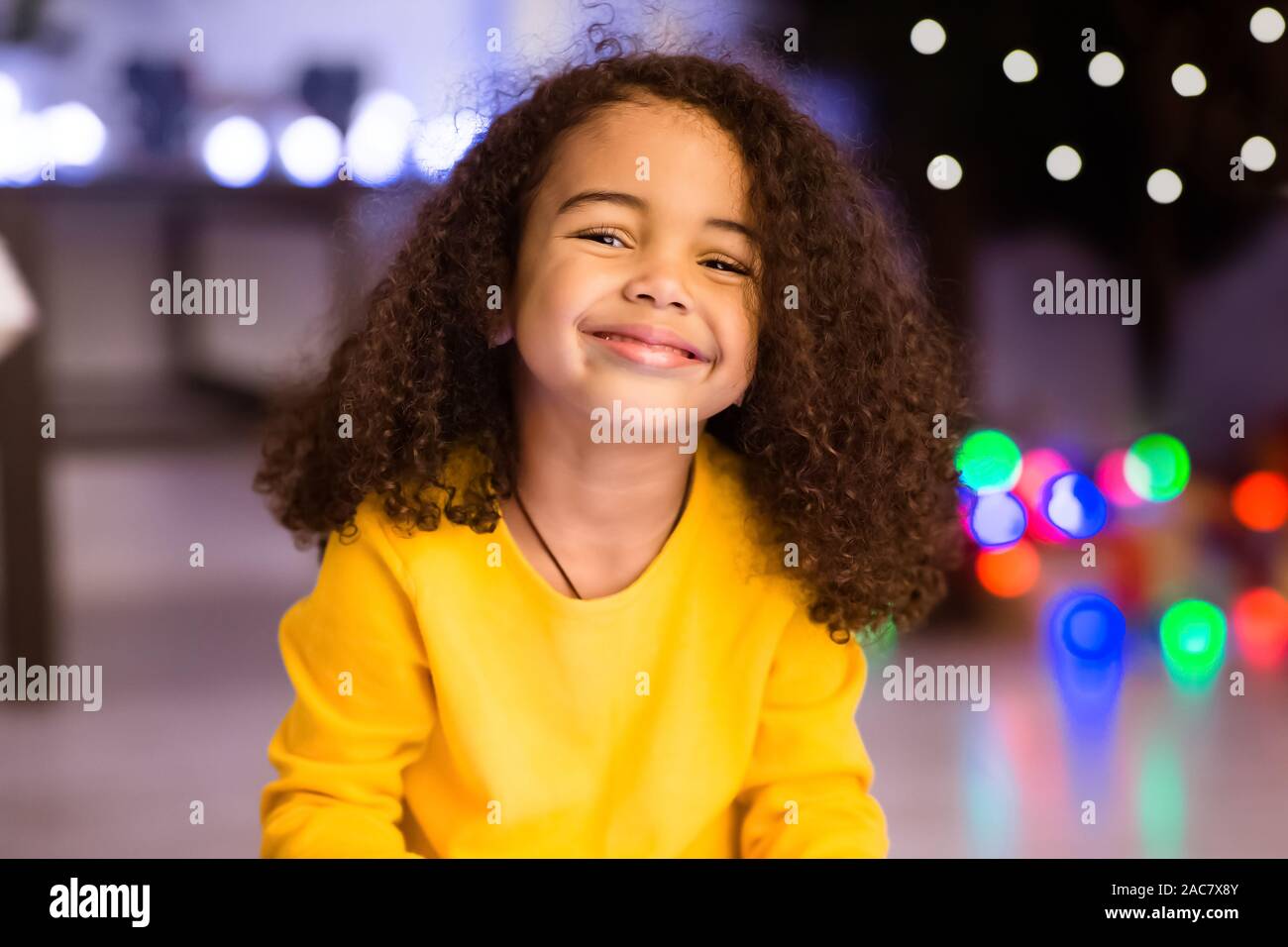 Happy african american little girl smiling at home Stock Photo - Alamy