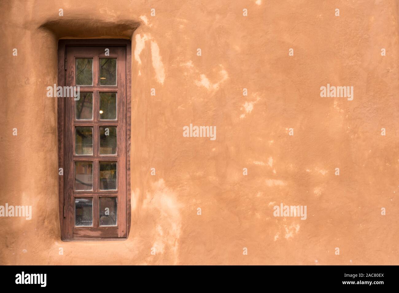 Old Southwestern Brown Adobe Wall and Window Stock Photo