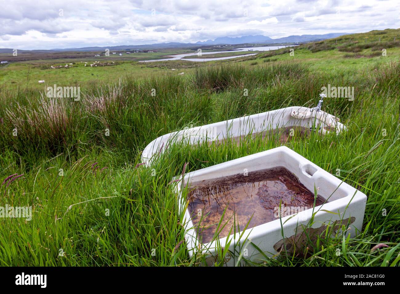 Sink and bathtub as trough in Roag, Skye island, Scotland, UK Stock Photo