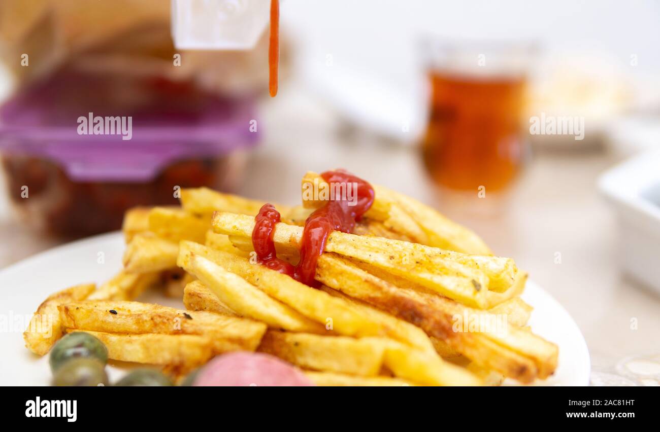 fried potatoes and spill ketchup on it Stock Photo Alamy