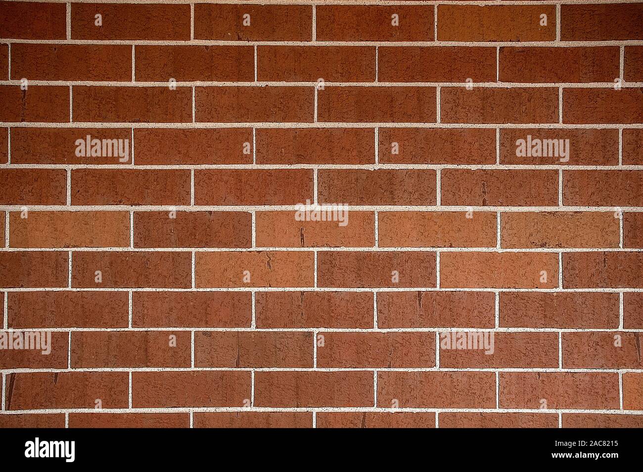 reddish brown brick wall background with slight concave curve Stock Photo