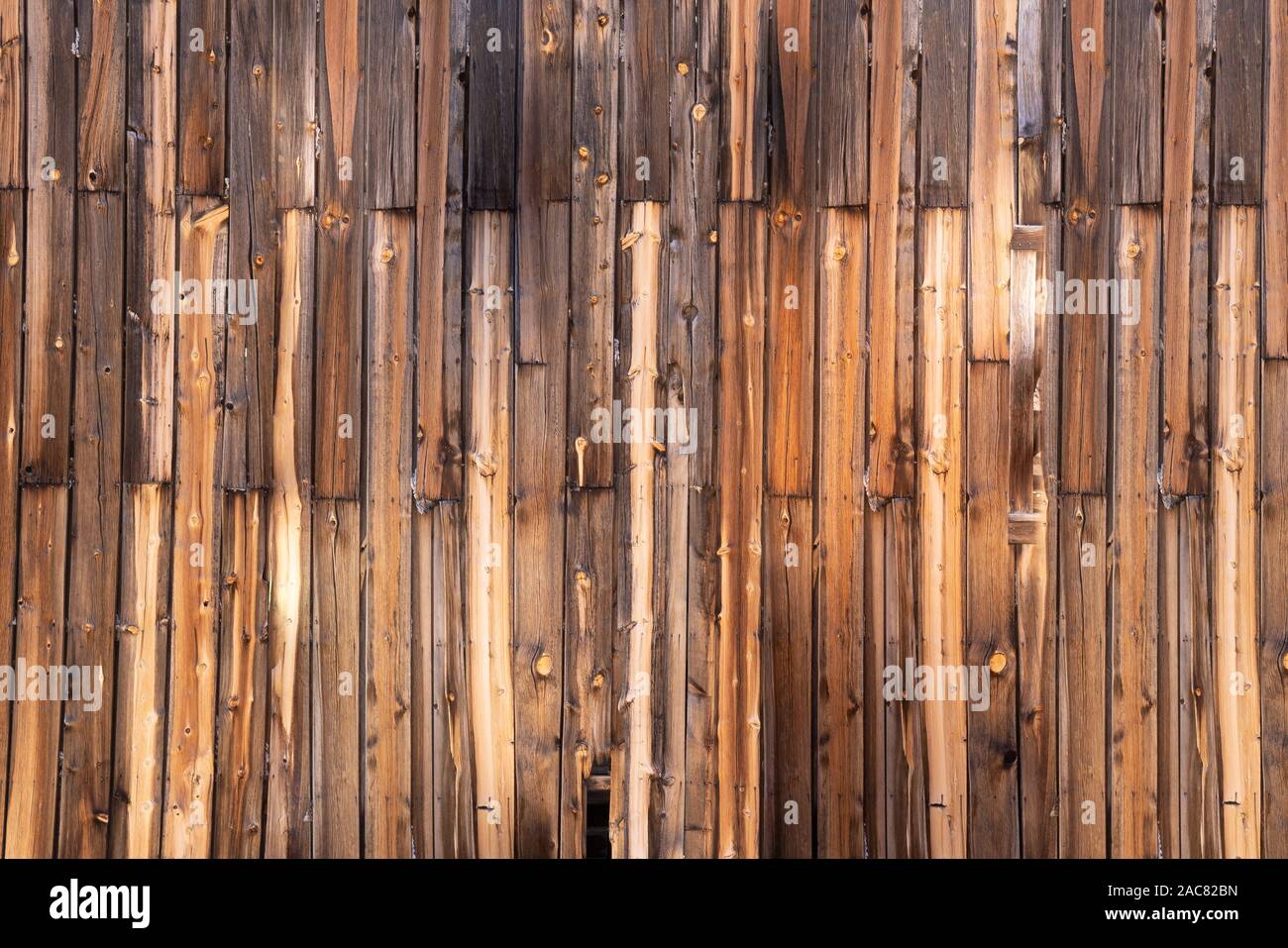 Exterior wall of old weathered wood background Stock Photo